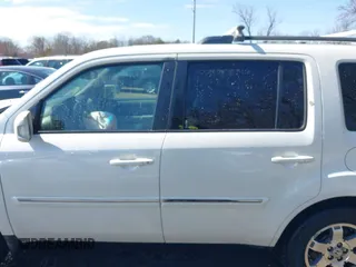 2011 Honda Pilot Touring with VIN 5FNYF4H96BB014095, listed as a IAAI auction lot 41794052 with 202,440 mi miles and . Bid and sale history available at DreamBid. Image 14.
