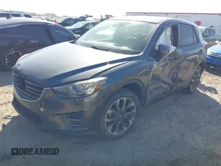 2016 Mazda CX-5 Grand Touring with VIN JM3KE4DY8G0823567, listed as a IAAI auction lot 41784384 with 143,836 mi miles and . Bid and sale history available at carsss.com. Image 17.