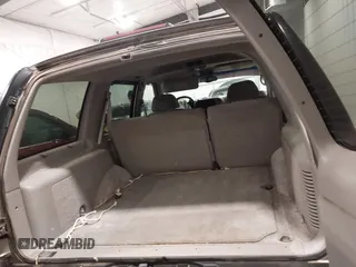 1999 GMC Yukon with VIN 1GKEK13R7XJ723255, listed as a IAAI auction lot 41879617 with 148,324 mi miles. Bid and sale history available at carsss.com. Image 17.