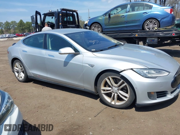 2015 Tesla Model S 85D with VIN 5YJSA1H2XFF084145, listed as a IAAI auction lot 42101755 with 105,660 mi miles. Bid and sale history available at carsss.com. Image 13.