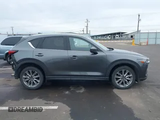 2020 Mazda CX-5 Grand Touring with VIN JM3KFBDM4L0829861, listed as a IAAI auction lot 41826250 with 62,091 mi miles and . Bid and sale history available at carsss.com. Image 14.