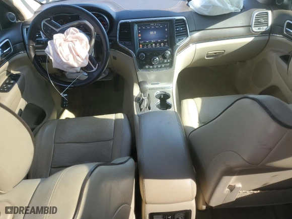 2017 Jeep Grand Cherokee Overland with VIN 1C4RJECG2HC712823, listed as a Copart auction lot 48063325 with 124,812 mi miles and Salvage Title. Bid and sale history available at carsss.com. Image 8.