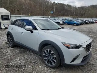 2019 Mazda CX-3 Touring with VIN JM1DKFC78K0405131, listed as a Copart auction lot 87065614 with 91,091 mi miles and Salvage Title. Bid and sale history available at carsss.com. Image 4.