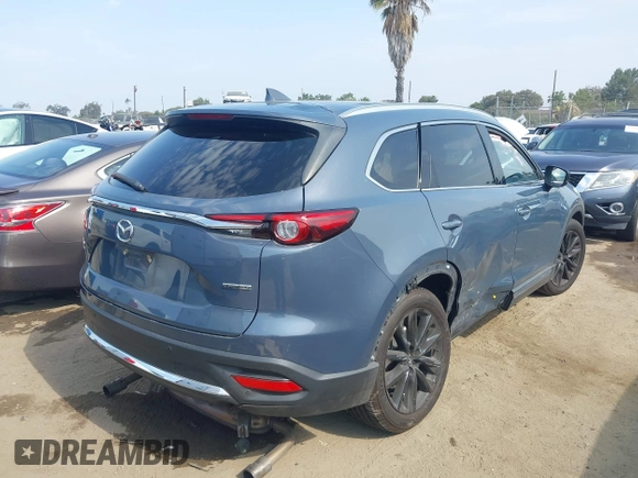 2021 Mazda CX-9 Carbon Edition z VIN JM3TCBDY0M0526352, wystawiony jako IAAI lot #42403901 z przebiegiem 50 193 mil mil oraz . Historia ofert i sprzedaży dostępna na DreamBid. Obrazek 4.