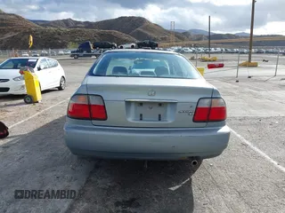 1996 Honda Accord LX with VIN 1HGCD5634TA291036, listed as a IAAI auction lot 41583543 with 166,725 mi miles and . Bid and sale history available at carsss.com. Image 16.