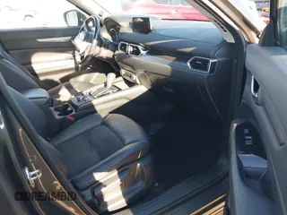 2017 Mazda CX-5 Touring with VIN JM3KFBCL2H0165625, listed as a IAAI auction lot 41879145 with 64,745 mi miles. Bid and sale history available at carsss.com. Image 5.