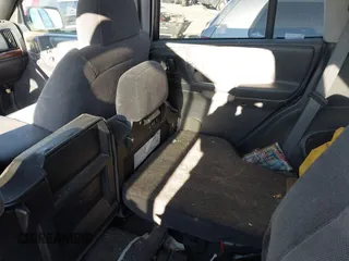 1997 Jeep Grand Cherokee Laredo with VIN 1J4GZ58SXVC687950, listed as a IAAI auction lot 40978411 with 176,514 mi miles. Bid and sale history available at carsss.com. Image 8.