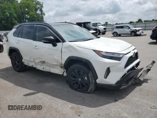 2022 Toyota RAV4 Hybrid XSE with VIN 2T3E6RFVXNW031612, listed as a Copart auction lot 60544055 with 99,831 mi miles and Salvage title. Bid and sale history available at DreamBid. Image 4.