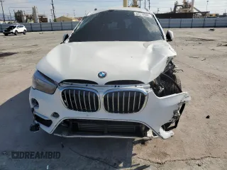 2017 BMW X1 sDrive28i with VIN WBXHU7C38H5H35352, listed as a Copart auction lot 44270505 with 68,047 mi miles and Salvage Title. Bid and sale history available at carsss.com. Image 5.