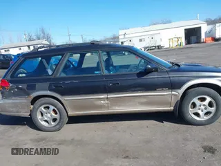1999 Subaru Legacy Outback z VIN 4S3BG6857X7627688, wystawiony jako IAAI lot #41712387 z przebiegiem 187 697 mil mil oraz . Historia ofert i sprzedaży dostępna na DreamBid. Obrazek 13.