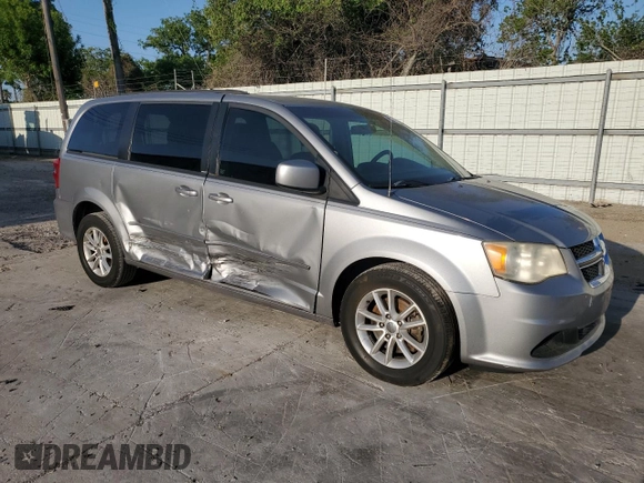 2014 Dodge Grand Caravan SXT with VIN 2C4RDGCG1ER121033, listed as a Copart auction lot 52030715 with 105,451 mi miles and Salvage Title. Bid and sale history available at DreamBid. Image 4.