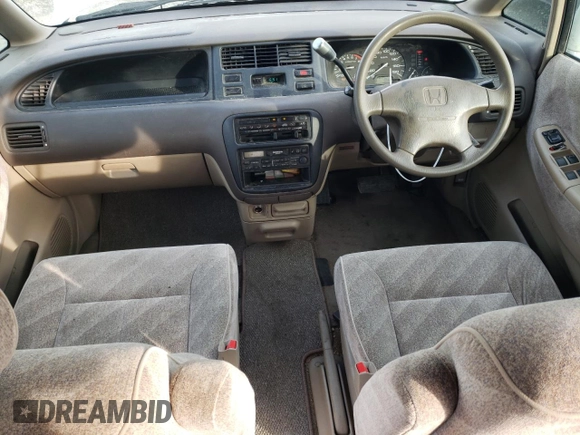 1998 Honda Odyssey with VIN RA31038664, listed as a Copart auction lot 43051785 with 106,084 mi miles and Salvage title. Bid and sale history available at DreamBid. Image 8.