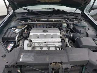 1996 Cadillac DeVille z VIN 1G6KF5298TU269234, wystawiony jako IAAI lot #41345945 z przebiegiem 34 218 mil mil oraz . Historia ofert i sprzedaży dostępna na DreamBid. Obrazek 10.