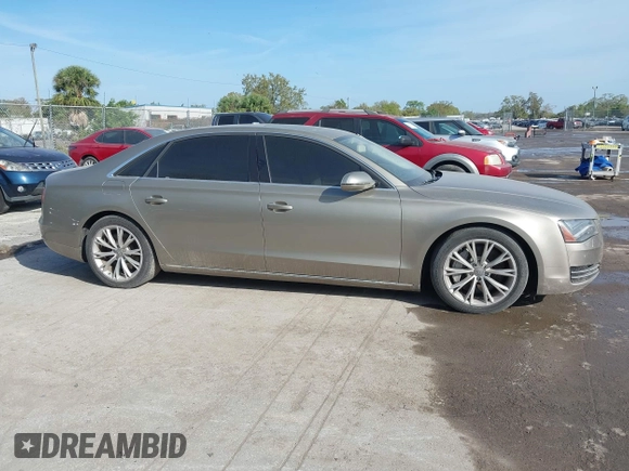2012 Audi A8 z VIN WAURVAFD3CN024063, wystawiony jako IAAI lot #41706508 z przebiegiem Nie podano mil oraz . Historia ofert i sprzedaży dostępna na DreamBid. Obrazek 13.