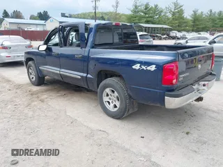 2005 Dodge Dakota Laramie with VIN 1D7HW58NX5S227633, listed as a IAAI auction lot 42122619 with 85,338 mi miles and . Bid and sale history available at DreamBid. Image 3.
