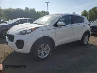 2018 Kia Sportage LX z VIN KNDPMCAC7J7448175, wystawiony jako Copart lot #59800765 z przebiegiem 138 825 mil mil oraz Czysty tytuł • Clean title. Historia ofert i sprzedaży dostępna na DreamBid. Obrazek 1.