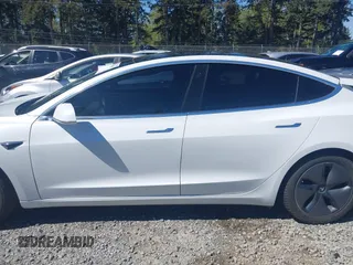 2018 Tesla Model 3 Long Range Battery with VIN 5YJ3E1EA7JF020173, listed as a IAAI auction lot 42046312 with 83,395 mi miles and . Bid and sale history available at DreamBid. Image 15.