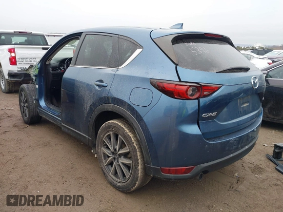 2017 Mazda CX-5 Grand Touring with VIN JM3KFADL9H0187338, listed as a IAAI auction lot 41382034 with 141,972 mi miles and . Bid and sale history available at carsss.com. Image 3.