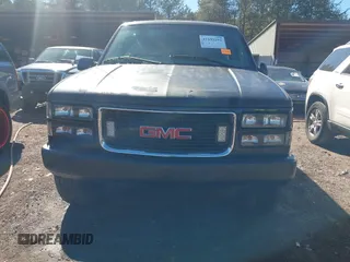 1999 GMC Yukon with VIN 1GKEK13R4XJ762708, listed as a IAAI auction lot 41653291 with 200,240 mi miles. Bid and sale history available at carsss.com. Image 6.