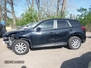 2014 Mazda CX-5 Touring z VIN JM3KE4CY4E0328880, wystawiony jako IAAI lot #42112302 z przebiegiem 185 228 mil mil oraz . Historia ofert i sprzedaży dostępna na DreamBid. Obrazek 15.