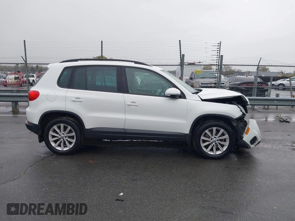 2015 Volkswagen Tiguan SE z VIN WVGBV7AX5FW584833, wystawiony jako IAAI lot #41855476 z przebiegiem 123 299 mil mil oraz . Historia ofert i sprzedaży dostępna na DreamBid. Obrazek 13.