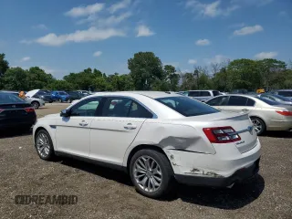 2014 Ford Taurus Limited with VIN 1FAHP2F84EG121559, listed as a Copart auction lot 61764825 with 82,548 mi miles and Salvage title. Bid and sale history available at DreamBid. Image 2.
