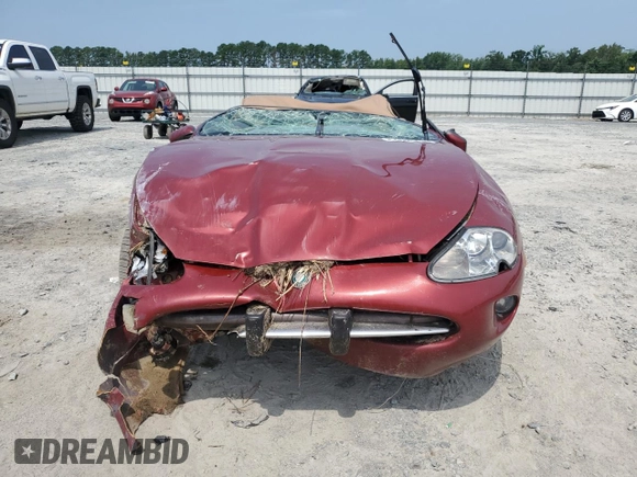 1999 Jaguar XK with VIN SAJGX204XXC038435, listed as a Copart auction lot 64843714 with Not Provided miles and Salvage Title. Bid and sale history available at DreamBid. Image 5.