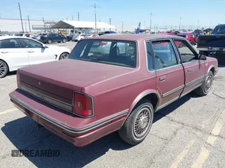 1988 Oldsmobile Cutlass Ciera with VIN 2G3AM5132J9375426, listed as a IAAI auction lot 42014990 with 292,060 mi miles and . Bid and sale history available at DreamBid. Image 4.
