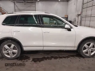 2013 Volkswagen Touareg Lux with VIN WVGEF9BP5DD011511, listed as a IAAI auction lot 41608840 with 167,350 mi miles and . Bid and sale history available at DreamBid. Image 14.