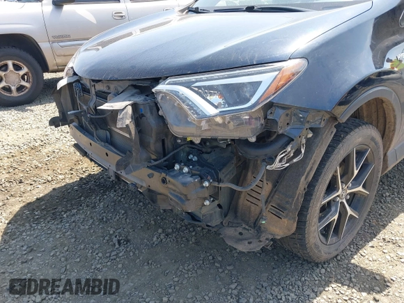 2018 Toyota RAV4 Hybrid SE with VIN JTMJJREV9JD191552, listed as a IAAI auction lot 42158665 with 84,025 mi miles and . Bid and sale history available at DreamBid. Image 17.