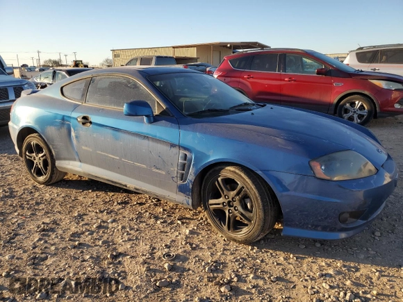 2005 Hyundai Tiburon GT z VIN KMHHN65F35U186438, wystawiony jako Copart lot #41879955 z przebiegiem 152 574 mil mil oraz Szkoda całkowita • Salvage title. Historia ofert i sprzedaży dostępna na DreamBid. Obrazek 4.