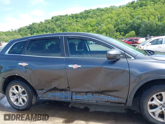 2014 Mazda CX-9 Touring with VIN JM3TB3CV9E0426767, listed as a IAAI auction lot 42301021 with 129,497 mi miles and . Bid and sale history available at DreamBid. Image 6.