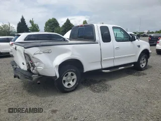 2002 Ford F-150 XL with VIN 1FTRX18L62KC53807, listed as a Copart auction lot 57463075 with 173,301 mi miles and Salvage title. Bid and sale history available at DreamBid. Image 3.