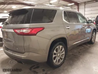 2018 Chevrolet Traverse Premier with VIN 1GNEVJKW0JJ165144, listed as a IAAI auction lot 41129951 with 137,593 mi miles. Bid and sale history available at carsss.com. Image 4.