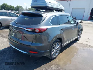 2022 Mazda CX-9 Grand Touring with VIN JM3TCBDY4N0618680, listed as a IAAI auction lot 40086806 with 34,142 mi miles and . Bid and sale history available at DreamBid. Image 4.
