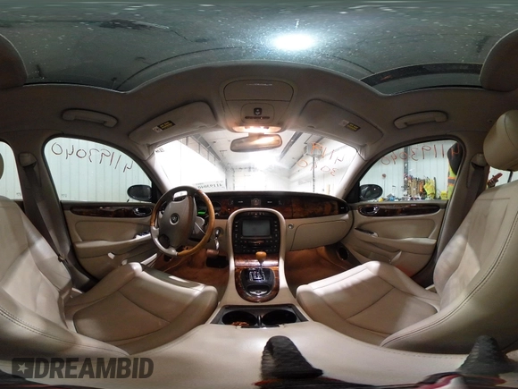 2004 Jaguar XJ with VIN SAJWA71C04SG33993, listed as a IAAI auction lot 41193040 with 79,944 mi miles. Bid and sale history available at carsss.com. Image 18.