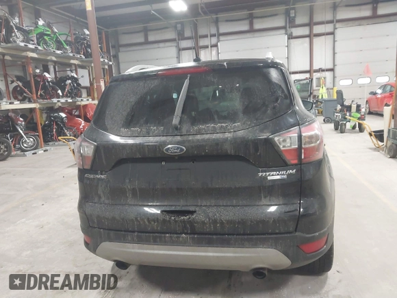2017 Ford Escape Titanium with VIN 1FMCU9J9XHUB51401, listed as a IAAI auction lot 41025642 with 77,908 mi miles. Bid and sale history available at carsss.com. Image 16.