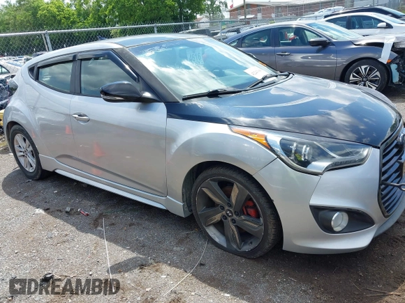 2013 Hyundai Veloster Turbo z VIN KMHTC6AE3DU136005, wystawiony jako IAAI lot #42243308 z przebiegiem 118 257 mil mil oraz . Historia ofert i sprzedaży dostępna na DreamBid. Obrazek 1.
