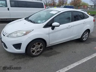 2013 Ford Fiesta S with VIN 3FADP4AJ5DM213417, listed as a IAAI auction lot 42023314 with 65,261 mi miles. Bid and sale history available at carsss.com. Image 2.