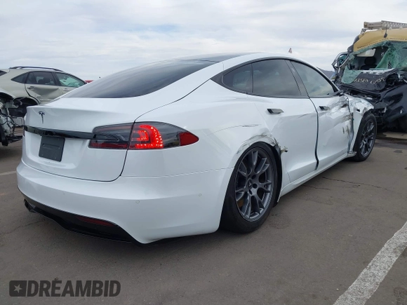 2021 Tesla Model S Long Range with VIN 5YJSA1E57MF453815, listed as a IAAI auction lot 41818700 with 51,176 mi miles and . Bid and sale history available at DreamBid. Image 4.