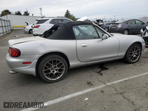 2004 Mazda MX-5 Miata LS with VIN JM1NB353440402453, listed as a Copart auction lot 45064475 with 151,508 mi miles and Salvage title. Bid and sale history available at DreamBid. Image 3.