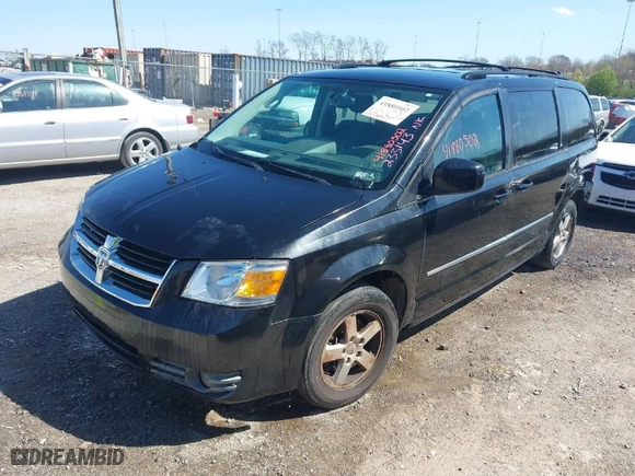 2010 Dodge Grand Caravan SXT with VIN 2D4RN5D18AR233143, listed as a IAAI auction lot 41880502 with 145,356 mi miles. Bid and sale history available at carsss.com. Image 2.