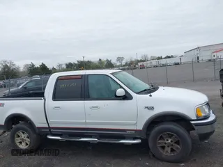 2003 Ford F-150 XLT with VIN 1FTRW08L43KA64328, listed as a IAAI auction lot 41932751 with 275,213 mi miles. Bid and sale history available at carsss.com. Image 13.