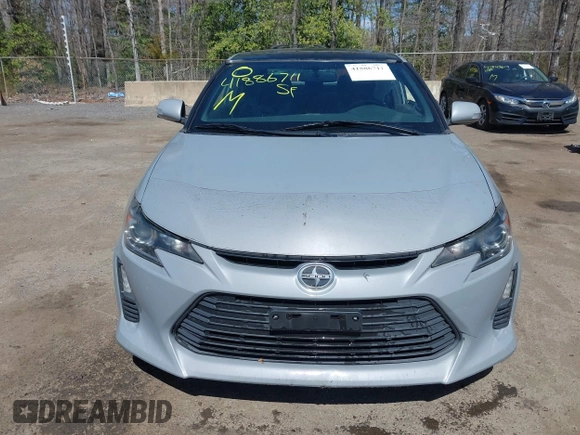 2014 Scion tC with VIN JTKJF5C70E3083839, listed as a IAAI auction lot 41886711 with 118,029 mi miles. Bid and sale history available at carsss.com. Image 12.