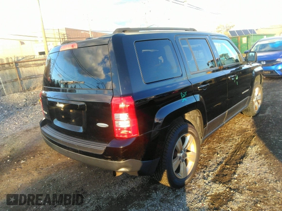 2014 Jeep Patriot Latitude with VIN 1C4NJRFB0ED799097, listed as a IAAI auction lot 40834502 with 192,940 mi miles. Bid and sale history available at carsss.com. Image 4.