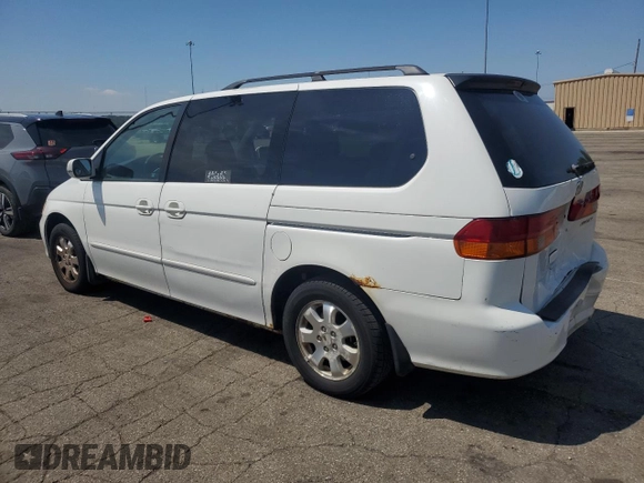 2002 Honda Odyssey EX with VIN 2HKRL18662H562178, listed as a Copart auction lot 63787995 with 256,072 mi miles and Salvage title. Bid and sale history available at DreamBid. Image 2.