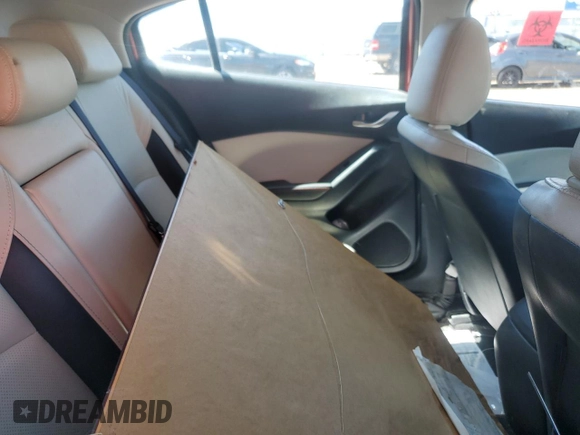 2014 Mazda 3 S Grand Touring z VIN JM1BM1M39E1101918, wystawiony jako Copart lot #55359215 z przebiegiem Nie podano mil oraz Nie do naprawy • Non repairable. Historia ofert i sprzedaży dostępna na DreamBid. Obrazek 10.