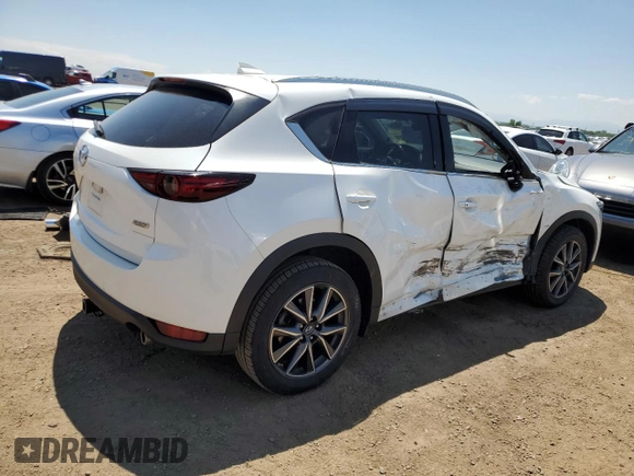 2018 Mazda CX-5 Grand Touring z VIN JM3KFBDM1J0473754, wystawiony jako Copart lot #60362245 z przebiegiem 72 792 mil mil oraz Szkoda całkowita • Salvage title. Historia ofert i sprzedaży dostępna na DreamBid. Obrazek 3.