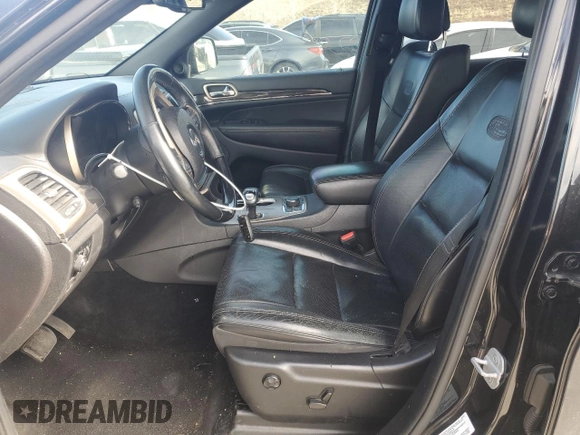 2014 Jeep Grand Cherokee Overland with VIN 1C4RJFCT2EC106002, listed as a Copart auction lot 48763675 with 143,011 mi miles and Salvage Title. Bid and sale history available at DreamBid. Image 7.