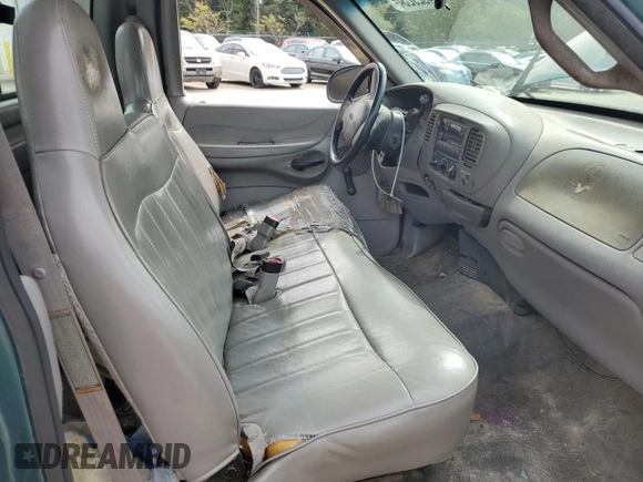 1998 Ford F-150 with VIN 1FTDF1726WNA02621, listed as a Copart auction lot 74929234 with 188,441 mi miles and Salvage title. Bid and sale history available at DreamBid. Image 7.